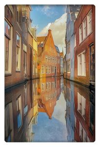 A serene canal in Delft, lined with colorful, traditional Dutch buildings perfectly reflected in the calm water below, creating a symmetrical, mirror-like effect.